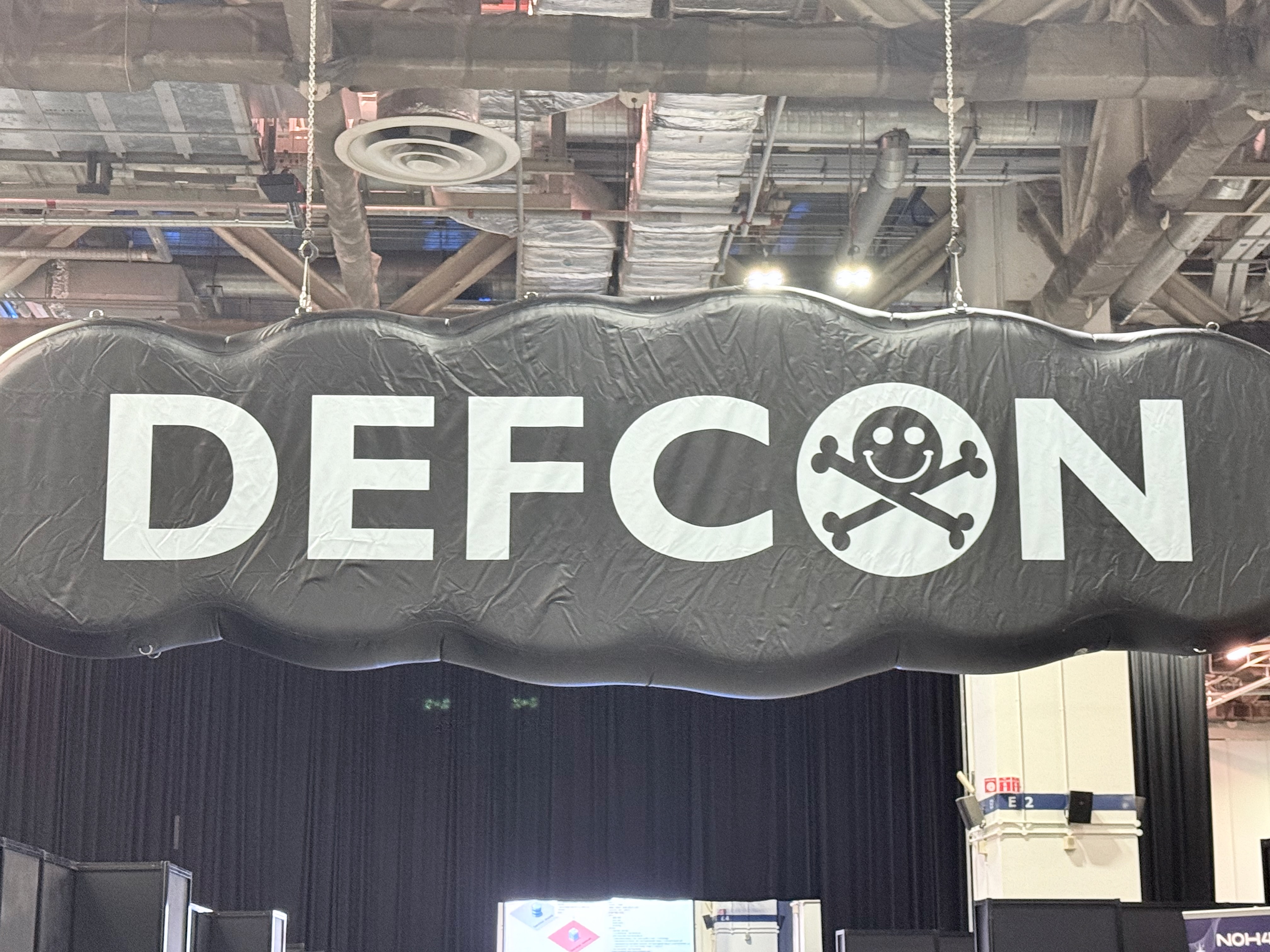 DEF CON banner above the conference floor where ICS Village runs trainings